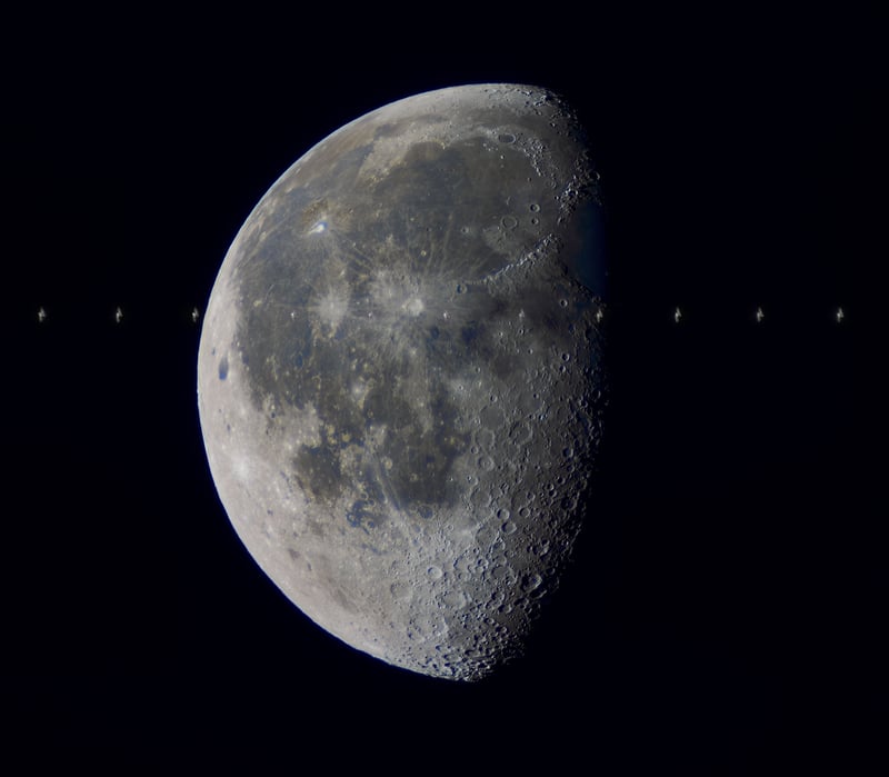 A composite image of the ISS transit in front of the moon.