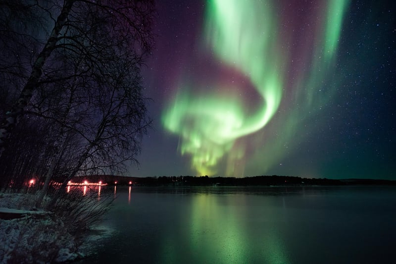 Northen lights over a frozen lake.