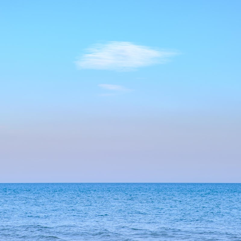 A lone cloud above the mediterranean sea.